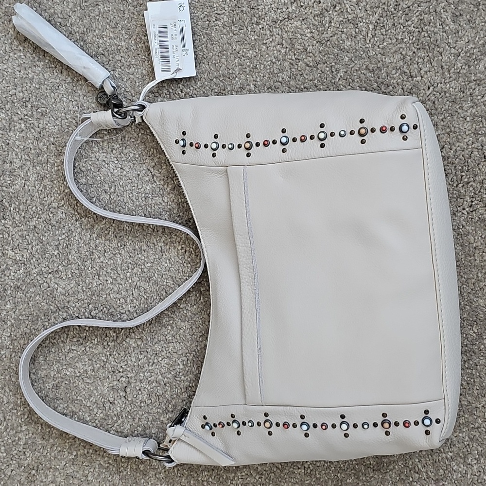 The Sak leather handbag in cream color.